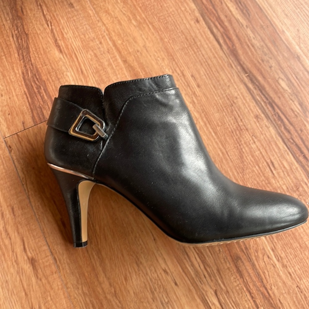 Vince Camuto ankle boots with silver buckle and heel hardware.